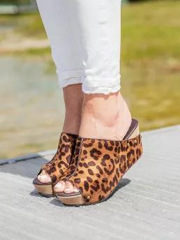 Gorgeous brown and tan with a hint of black adorns most of the upper on this must have wedge. Quickly step into these wedges that matches with so many outfits. Lightly padded insole. Heels measure 2.75 inches and platform 1 inch. True to size.