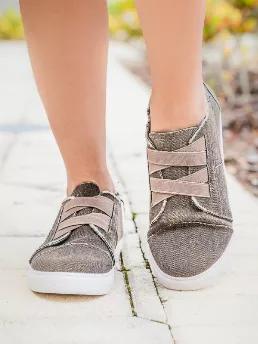Stylish canvas step in sneaker made with elastic straps and memory foam insole for all day comfort when you're on the go. Color is in the brown, light coffee color. True to size.