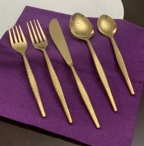 Make your dinner table setting exciting with our luxurious flatware set. Whether you are looking for gold silverware set, black flatware set or modern flatware, we have it all. Give an elegance to your dining room table settings with our artisan cutlery set in formal dinner setting or casual. A perfect stainless-steel silverware to gift. Set Includes 4 pieces of each: 8" Dinner Fork, 9" Dinner Knife, 8" tablespoon, 7" teaspoon, 7" salad fork. PVD coated shiny golden flatware set. Total Weight of