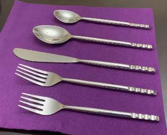 Make your dinner table setting exciting with our luxurious flatware set. Whether you are looking for gold silverware set, black flatware set or modern flatware, we have it all. Give an elegance to your dining room table settings with our artisan cutlery set in formal dinner setting or casual. A perfect stainless-steel silverware to gift. Set Includes 4 pieces of each: 8" Dinner Fork, 9" Dinner Knife, 8" tablespoon, 7" teaspoon, 7" salad fork. Silver glossy finish flatware set. Total Weight of th