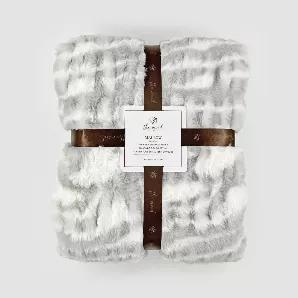 Made of silky faux fur fibers and smooth faux mink backing, this ruched and tie-dyed throw collection brings the vintage vibes and toasty warmth to a modern home. Material: 100% polyester