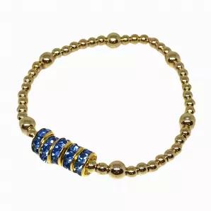 Part of our Holiday '21 Collection:<br>
<br>
7" beaded bracelet featuring five centered spahhire rings. Assorted gold bead sizes on stretch cord with tie closure. Sold in packs of 5<br>
<br>

