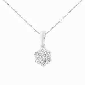 This stunning floral cluster pendant is designed with 7, natural diamonds in a glistening prong setting. Designed in the finest 14k white gold, this necklace boasts 1/2 carat Total Diamond Weight. This is the perfecarat accessory for any night out.