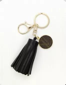 Black vegan leather tassel keychain with Louis Vuitton Charm. Charm repurposed from LV Speedy 35 FH1912.
