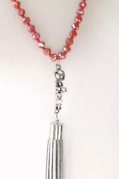 Red crystal knotted multi-layer necklace with "Believe" connector and metallic silver vegan suede tassel.