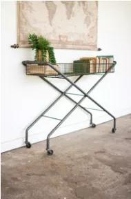 Whether it's filled with books or plants, this rolling wire console is a versatile addition to any home, office or garden.