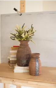 This set of two mango wood urns make a perfect addition to your home!  Display an arrangement or single stem of our faux florals, dried stems, or use as an sculptural addition to your decor.