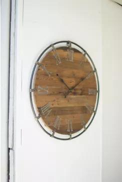 Beautiful reclaimed wood and metal rim clock adds a special touch to your home.  The metal roman numerals make a rustic addition to the look.
