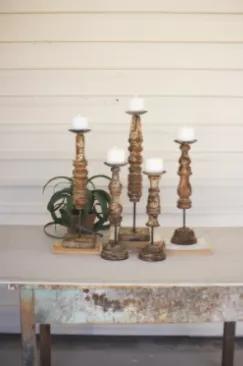 Light up the room with this beautiful set of repurposed wooden finial candle stands.