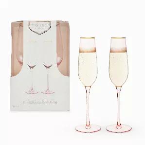 Sip Your Wine Through Rose Tinted Glasses. These Pale Pink Sparkling Champagne Flutes Give An Extra Rosy Hue To Your Favorite Champagne, Prosecco, Or Sparkling Ros?, And The Electroplated Gold Rim Adds Extra Sparkle To Your Bubbly. Set Of 2 Rose-Tinted Crystal Sparkling Wine Glasses. 8 Oz. Capacity. Gold Rimmed. Set Of 2 Pink Tinted Wine Glasses - These Pink-Tinted Crystal Sparkling Wine Glasses Bring A Rosy Hue To Your Favorite Vintage. Skip Boring Clear Wine Glasses And Add Some Color To Your 