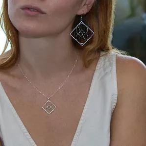 <p><span style="font-weight: 400;">Rael Cohen Jewelry</span></p>
<p><br></p>
<p><span style="font-weight: 400;">A diamond shaped drop earring might be a girl’s new best friend. 24k gold plate, rose gold, or silver geometric yet curvy drop earrings highlight shape, simplicity, and effortless beauty. Wear these perfectly weightless drop earrings solo or pair them with our matching geometric pendant necklace in gold or silver.</span></p>
<p><br></p>
<ul>
<li style="font-weight: 400;"><span style=
