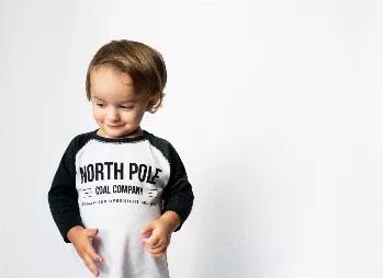 <p>Who's kids are getting COAL for Christmas? Be sure to get your orders in to the North Pole Coal Company, Santa guarantees overnight delivery! </p> <p>Get your kids on their best behavior with our North Pole Coal Company shirt and give them a daily reminder of what happens when you end up on the NAUGHTY list! </p> <p>Our North Pole Coal Company Raglan is an exclusive Brooklyn+Fifth design and is printed on a soft and stylish Baseball tee. Be sure to check out our MATCHING North Pole Coal Compa