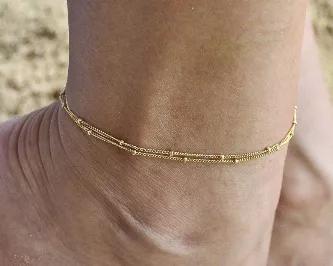 You have just found the dainty anklet bracelet that has the power to make women feel:<br>
- chic and stylish; <br>
- feminine and elegant;<br>
- unique and fabulous.<br>

Product - details and features:<br>
- 9" anklet comes with 2" attached extender (9" - 11");<br>
- 14k Gold Filled 1mm satellite chain;<br>
- Two chains attached to one clasp;<br>
- 14k Gold Filled spring ring closure;<br>
- 14k Gold Filled wire wrapped details;<br>
- handmade in California, USA.<br>

This elegant piece handcraf