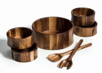 Beautiful large salad bowl comes complete with serving utensils and 4 matching individual salad bowls.  The perfect hostess, housewarming, or wedding gift.  Made from environmentally friendly Acacia wood.  Handcrafted from solid acacia wood, a high-quality hardwood great for culinary applications