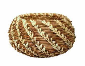Learn how to weave a pine needle basket. Step-by-step you will learn how to coil and stitch a fragrant pine needle basket of your own design. Choose from eight easy basketry stitches and a variety of lovely basket shapes. As you stitch your basket, you will develop mindfulness - a wonderful, calming activity! Prepare to spend some time on this project. It could take about 6 hours over several days. The kit contains pine needles, raffia, a tapestry needle, a coiling gauge and color photo instruct