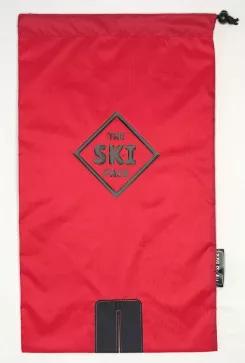 The patent pending red Ski Pack features red fabric and dark navy straps.   This premier ski carrier is specifically designed for downhill snow skis and allows the wearer to carry skis in a hands-free manner. Poles can be carried by inserting ski pole, grip first, into the pack with the skis. The Big Kid Ski Pack (inclusive of adults) fits adult shoe sizes 5-14. This ski carrier folds up to fit in most jacket pockets and should not be worn on any ski lift. In some light, the straps and logo a