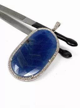 <p>Natural Sapphire Diamond Sterling Silver Pave Pendant September Birthstone.</p> <p>** HANDMADE PENDANT**<br> SOLD AS : 1 PIECE<br> SIZE : 62mm X 32mm (including Bail)<br> GROSS WEIGHT : 14.08g<br> STONE WEIGHT : 7.2g<br> DIAMOND WEIGHT : 0.76Ct.<br> DIAMOND COLOR : K COLOR<br> PRECIOUS GEMSTONE: NATURAL GENUINE SAPPHIRE<br> SAPPHIRE GRADE : AAA+ Grade<br> SAPPHIRE ORIGIN : MADAGASCAR<br> FACETED : YES<br> TREATMENT : NO<br> METAL : 925 STERLING SILVER<br> SHAPE : FREE FORM FANCY SHAPE<br> DIA