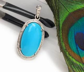 <p>Natural Genuine Sleeping Beauty Turquoise Sterling Silver Pave Diamond Pendant.<br> SIZE : 42.85mm X 19mm X 9mm ( including Bail)<br> GROSS WEIGHT : 8.75g<br> STONE WEIGHT : 3.31g<br> DIAMOND WEIGHT : 0.33 Cts<br> DIAMOND COLOR : I - J Color<br> GEMSTONE : NATURAL SMOOTH TURQUOISE<br> GRADE : AAA+ GRADE<br> ORIGIN : ARIZONA<br> TREATMENT : NO TREATMENT<br> METAL : 925 STERLING SILVER<br> SHAPE : OVAL<br> HANDMADE<br> **All Measurements are close approximations**</p> <p>SLEEPING BEAUTY TURQUOI