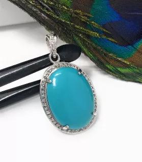 <p>Natural Genuine Sleeping Beauty Turquoise Sterling Silver Pave Diamond Pendant.<br> SIZE : 38mm X 19mm X 9mm ( including Bail)<br> GROSS WEIGHT : 9.08g<br> STONE WEIGHT : 20.80 CT's<br> DIAMOND WEIGHT : O.43 CT's<br> DIAMOND COLOR : K Color<br> GEMSTONE : NATURAL SMOOTH TURQUOISE<br> GRADE : AAA+ GRADE<br> ORIGIN : ARIZONA<br> TREATMENT : NO TREATMENT<br> METAL : 925 STERLING SILVER<br> SHAPE : OVAL<br> HANDMADE<br> **All Measurements are close approximations**</p> <p>SLEEPING BEAUTY TURQUOIS