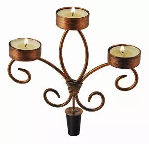 Turn Your Favorite Bottle Of Wine Into A Centerpiece! Place The Wrought Iron Candelabra Into A Clean, Empty Wine Bottle. Add 3 Tea Lights And Voila! The Perfect Candle Holder For Any Wine Lover. Includes 3 Tea Light Candles. <Ul><Li>Brushed Copper Finish</Li><Li>Provides A Secure Fit</Li><Li>Tea Light Candles Included</Li><Li>Accommodates 3 Tea Light Candles</Li><Li>Makes A Great Gift</Li></Ul> Fits Securely In Standard Bottles Crafted From Wrought Iron With Brushed Copper Finish Includes 3 Teal