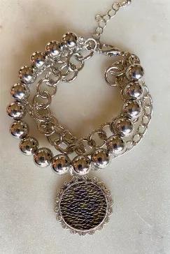 3 strand beaded bracelet with 2 links chain. Authentic designer material upcycled on charm with clear stones. 7" long with 1.5" extension. Lead and nickel free. Note that the clover will be one of 2 designs.
