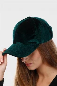 Soft velvet baseball cap in authentic vintage Gucci button added to the left side of hat. Adjustable velcro strap in the back.