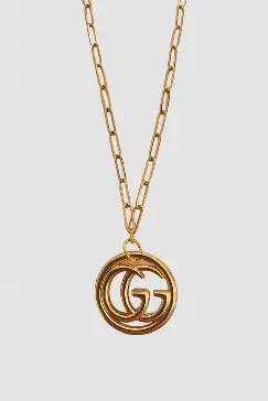 Gorgeous up-cycled authentic designer necklaces. The pendants are made of a vintage designer button or pull originally on the clothing of the specified designer. Chains are all satellite chains unless otherwise noted and are approximately 17". Gucci pendant is approximately 1" in length. Lead and nickel free.