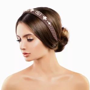 Designer Inspired Brown Woven Vegan Leather Headband Featuring Gold Metal, Pearl and Rhinestone Logo Detailing. Headband measures 1 inch wide