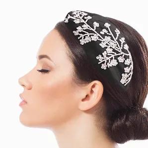 Black Fabric Wire Headband Featuring White Bead and Pearl Flower Embroidery Detail and Center Knot. Ivory Fabric Interior. Headband measures 3 inches wide