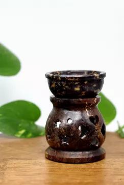 These heavy soapstone aroma lamps come in a variety of shades with star and moon carvings. They sit 3" high. These aroma diffusers are a great way to warm your favorite oil. Place a candle in the bottom and pour the oil in the upper bowl to enjoy. 