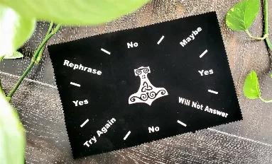 Ask the pendulum your deep questions + let the universe help you sort it out. Pagan God, Thor's hammer is featured in the center of this Black Velvet Pendulum Mat with silver print. Use this Mat as a guide for the answer to your query.<br>

Size 8 x12"