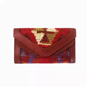 Type: Wallet & Crossbody Bag <br> 
- Designed in Canada <br> 
- Handmade in Turkey <br> 
- Water Resistant <br> 
- Unisex <br> 
Materials: <br> 
- Handwoven Wool Kilim <br> 
- Leather <br> 
- Leather Strap <br> 
Cleaning & Care: <br>
Cleaning of kilim products is similar to cleaning a Turkish rug: Use either a clean piece of sponge or cloth along with carpet shampoo.  <br>        *Additional photos are for shape and size reference. The bag for sale is the first three photos listed.