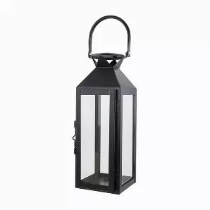 Looking for a way to add a much-needed detail to your design? Bring a touch of modern classic design with our Black Contemporary lantern.  The contemporary black lantern stands at 15 inches tall, 4 inches wide and 4.5 inches deep.  The metal body construction of the lantern is painted in black and is finished with a protective clear coat, the body of the lantern is adorned with clear glass. The included metal handle allows for ease of transport and for hanging. With enough room for an up to 3 in
