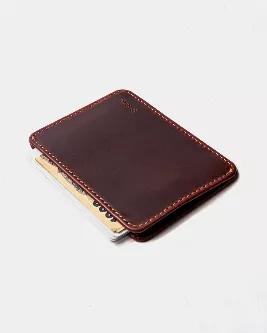 <p>The Slimmy R1S2 (83mm) in the oil tan colorway eliminates all excess layers of leather making it the thinnest international leather wallet (4mm thin) on the market.</p><br><ul><br><li>Featuring a 1-pocket / 2-slot Open Design.</li><br><li>Extra height to accommodate larger sized bank notes.</li><br><li>Clean cut edge and rounded corners with proprietary rubberized dye treatment. No folded leather. Maximum compactness with room to spare.</li><br><li><br><strong>Made for the US dollar or larger