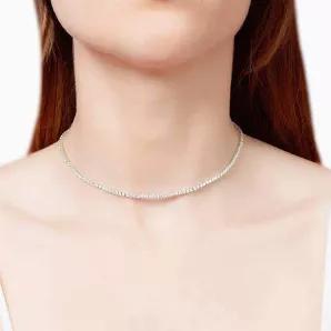 This Cz Simulated Diamond Tennis Necklace Is A Traditional, Elegant Design Sizzling With Sparkling Crystals For An Unforgettable Effect! This Is One You'Ll Reach For Over And Over Again, Knowing That Each Time You Wear It, You'Ll Look Fabulous! Sterling Silver (925). Cubic Zirconia Diamonds. Length: 12 Inches + 4 Inches Extension. E-Coating Protection (Anti-Tarnish).

Absolutely Gorgeous Piece!!!