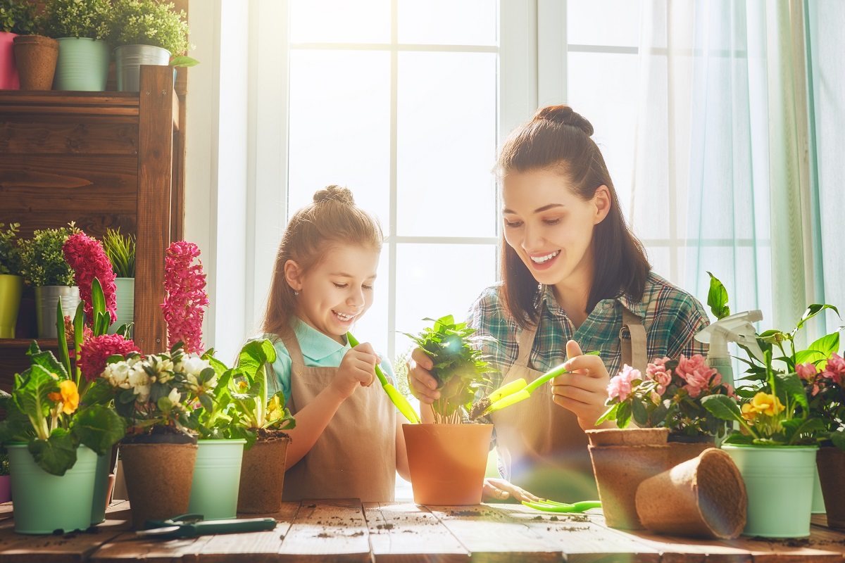 A girl and a woman planting